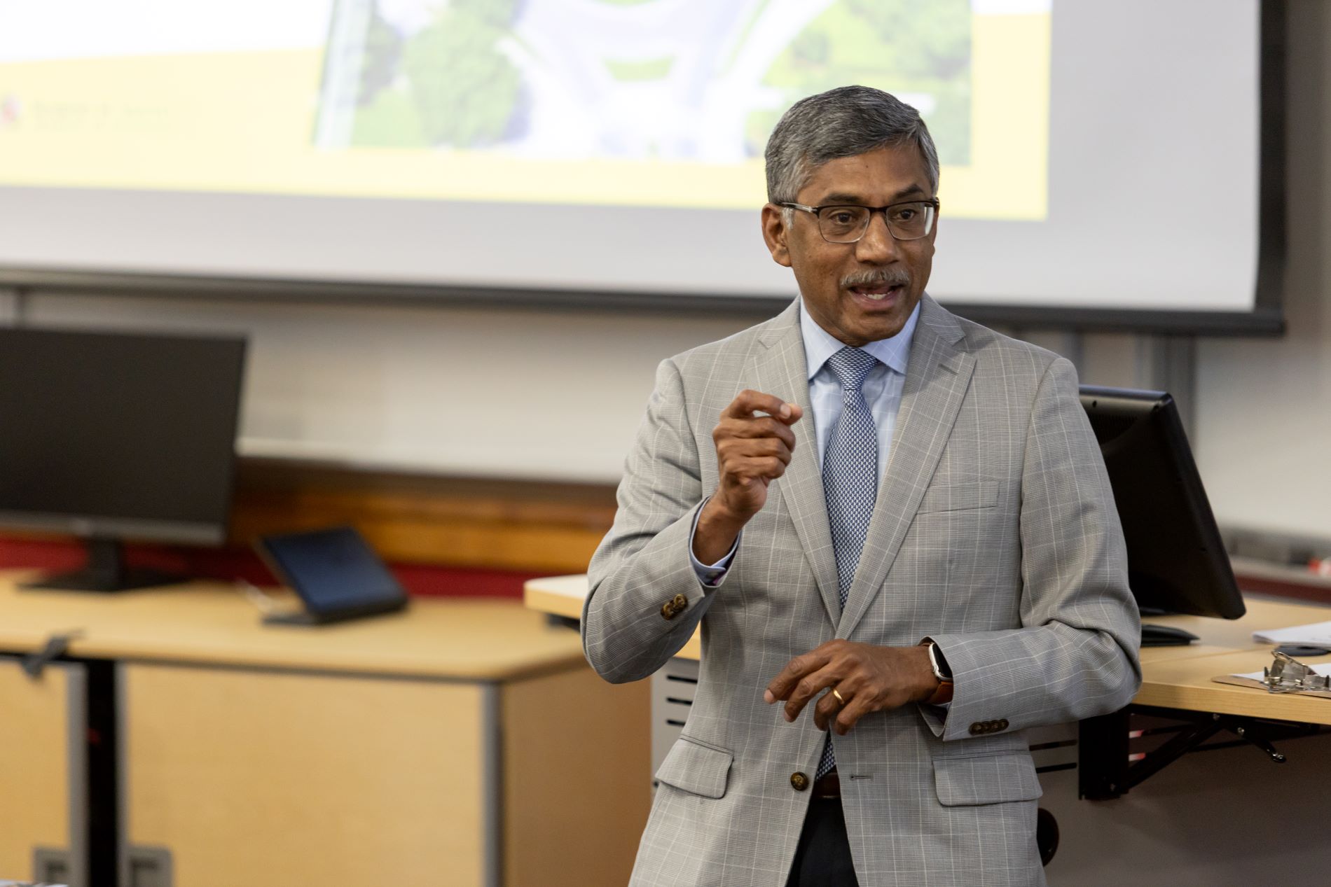 Dean Konana addresses classroom